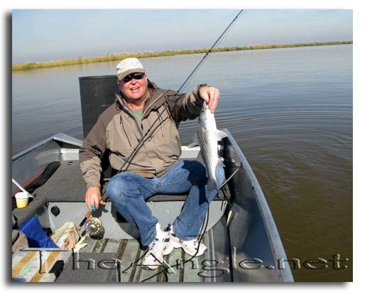 [Image, Dad with 4 pound deltta striper]