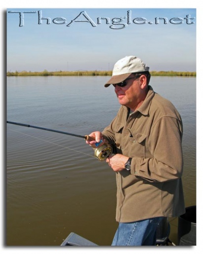 [Image, Dad with flyfishing hook-up]