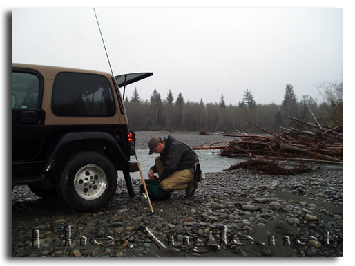 [Rigging fly rods at the jeep]